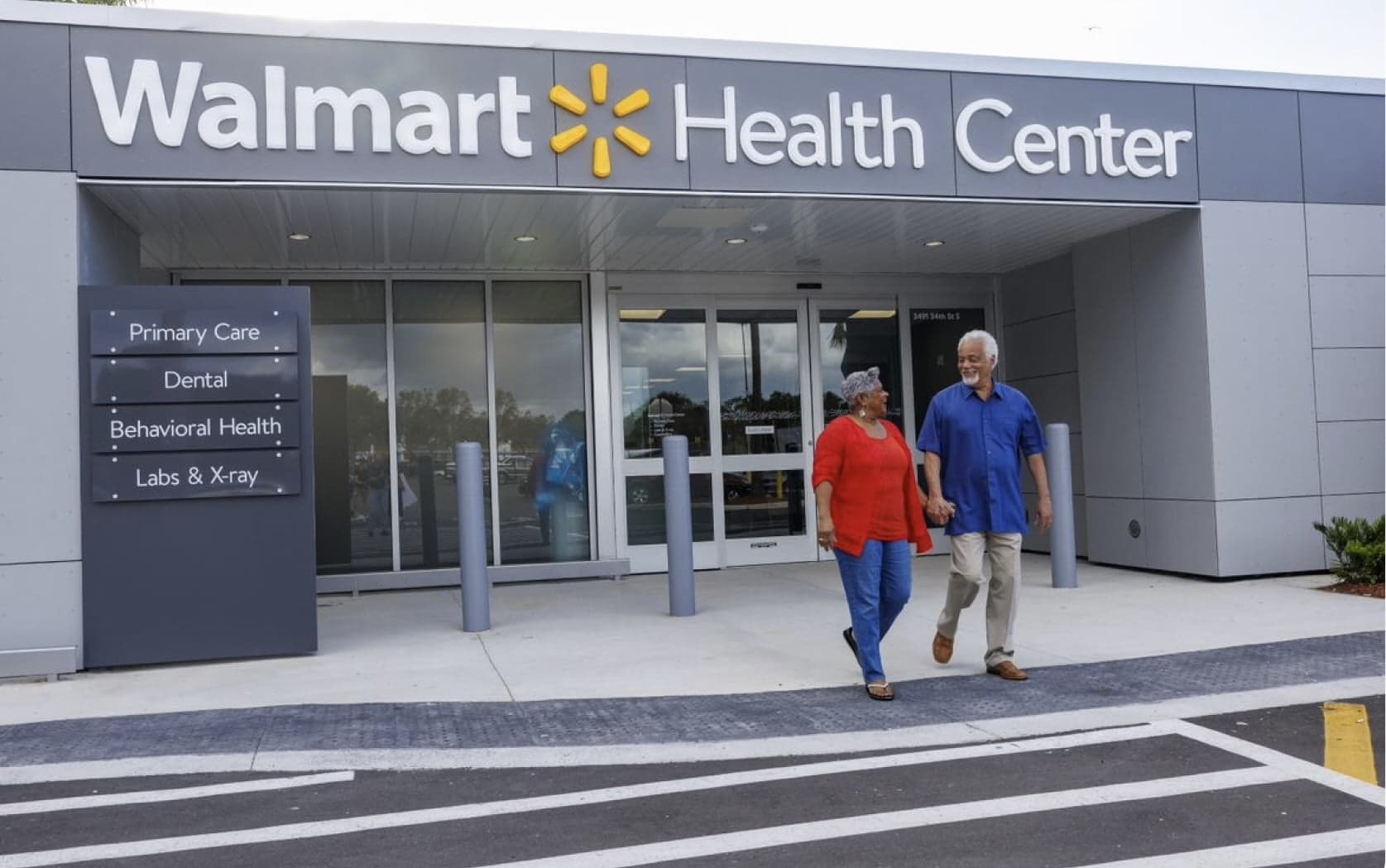 two patients walking out of a Walmart Health center
